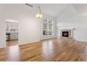 Spacious living room with hardwood floors, fireplace and high ceilings at 7944 E Lowry Blvd, Denver, CO 80230