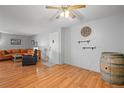 Living room with hardwood floors, a decorative barrel, and a clock at 6505 Kalua Rd # 204B, Boulder, CO 80301