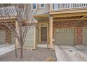 Exterior of home with brick accents, garage, front door, and small rock garden at 12898 King St, Broomfield, CO 80020