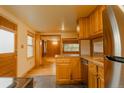 Updated kitchen with granite countertops, stainless steel appliances, and hardwood floors at 4850 Forest Hill Rd, Evergreen, CO 80439