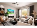 Bright living room with a modern fireplace, large windows, and a comfortable sofa at 1950 Grayside Cir, Castle Rock, CO 80109