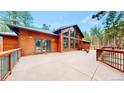 Beautiful deck with wood railing, offering stunning outdoor living space at 12655 Greenland Acres Rd, Larkspur, CO 80118