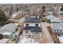 Newly constructed homes with gray siding and dark roofs, viewed from above at 3224 W Dakota Ave, Denver, CO 80219