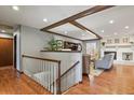 Bright living room featuring hardwood floors and a cozy fireplace at 9161 W Hialeah Pl, Littleton, CO 80123