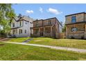 Charming two-story brick home with well-manicured lawn, enhancing curb appeal at 2515 N Gaylord St, Denver, CO 80205