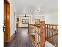 Bright living room featuring wooden floors and stairway to another floor at 8182 3Rd Ave, Arvada, CO 80007