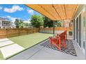The cozy backyard patio with modern cedar shade covering offers great space for entertaining at 3657 Pecos St, Denver, CO 80211