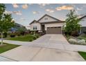 Beautiful home featuring a spacious driveway, well-kept lawn, and attractive curb appeal at 565 Pikes View Dr, Erie, CO 80516