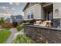 Inviting front porch with comfortable seating and stylish decor, perfect for relaxing outdoors at 565 Pikes View Dr, Erie, CO 80516