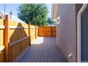 Back porch overlooking newly stained wooden fence at 665 S Meade St, Denver, CO 80219