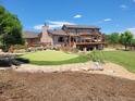 Multi-level deck and a private putting green makes this backyard ideal for entertaining and relaxation at 3191 W 151St Ct, Broomfield, CO 80023
