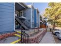 This exterior of the home features a multi-Gathering residence with stairs leading to the upper level at 7205 S Gaylord St # F15, Littleton, CO 80122