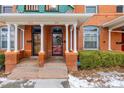 Two-story home with a classic porch and brick facade at 1944 W 33Rd Ave, Denver, CO 80211