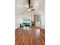 Spacious living room with brick fireplace, vaulted ceiling and built-in seating at 10262 W Ida Ave # 243, Littleton, CO 80127