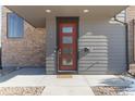 Modern front door with glass panels and stone accents at 2800 S Dexter Way, Denver, CO 80222