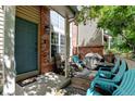 Inviting covered patio with seating area, perfect for outdoor relaxation and entertaining guests at 10035 E Mexico Ave, Aurora, CO 80247