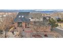 Classic brick two-story residence featuring a landscaped garden and beautiful brick walkway at 767 Ellis St, Golden, CO 80401