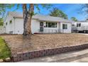 Well-maintained single-story home with a rockscape yard at 5142 S Pennsylvania St, Littleton, CO 80121