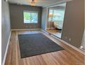 Open concept living space showcasing hardwood floors and abundant natural light, seamlessly connecting to other rooms at 5142 S Pennsylvania St, Littleton, CO 80121