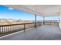 A spacious back deck with a great view is perfect for relaxing or entertaining outdoors at 3976 Breakcamp Ct, Castle Rock, CO 80108