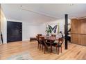 Spacious dining room with wood floors and access to hallway, kitchen, and open areas at 3377 Blake St # 205, Denver, CO 80205