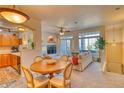 Inviting living room and dining area with large windows providing natural light at 494 Black Feather Loop # 117, Castle Rock, CO 80104