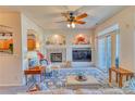 Cozy living room featuring a fireplace, entertainment center, and plush seating at 494 Black Feather Loop # 117, Castle Rock, CO 80104