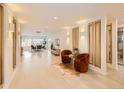 Spacious open living area with pristine hardwood flooring and bright natural light throughout the home at 6585 E Nevada Pl, Denver, CO 80224