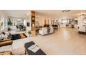 Bright and airy living space featuring open layout, modern finishes, and a seamless flow for versatile living at 6585 E Nevada Pl, Denver, CO 80224