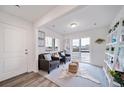 Bright, airy living room with large sliding glass doors and stylish decor at 13563 E 103Rd Pl, Commerce City, CO 80022