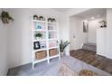 Stylishly decorated room with elegant ladder shelving and plants at 13563 E 103Rd Pl, Commerce City, CO 80022