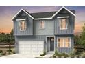 Charming two-story home with neutral siding and modern architectural details at 16947 W 92Nd Dr, Arvada, CO 80007