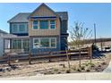 Beautiful two-story home with a backyard fence and landscaping at 16947 W 92Nd Dr, Arvada, CO 80007