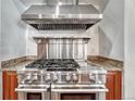 High-end stainless steel range and range hood in gourmet kitchen at 9535 S Shadow Hill Cir, Lone Tree, CO 80124