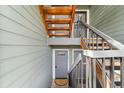 Building entrance with stairs leading to apartments at 3656 S Depew St # 104, Denver, CO 80235