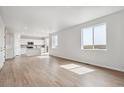 Spacious living room with hardwood floors, ample natural light, and open layout at 3464 N Irvington St, Aurora, CO 80019