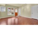 Inviting living room featuring hardwood floors, bright windows, and neutral paint, creating a warm atmosphere at 3223 Iron Forge Pl # 108, Boulder, CO 80301