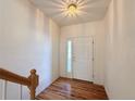 Bright entryway with hardwood floors, white walls, and a view of the staircase at 246 Rockview Dr, Superior, CO 80027