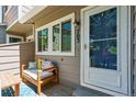 Cozy front porch with bench seating and a view of the front door at 703 S Depew St, Lakewood, CO 80226