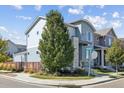 Charming home with blue siding, and a well-maintained lawn on a corner lot at 6777 Mariposa St, Denver, CO 80221