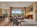 Inviting living room with large windows, comfortable seating, and a cozy atmosphere at 1001 Deer Clover Way, Castle Pines, CO 80108
