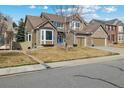 Charming two-story home with a three-car garage and a well-maintained front yard at 19665 E Ida Pl, Aurora, CO 80015