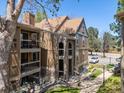 Exterior view of townhome with balconies and updated stone facade at 10970 W Florida Ave # 225, Lakewood, CO 80232