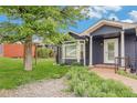 View of the home exterior with lush green lawn at 401 N Columbine St, Golden, CO 80403
