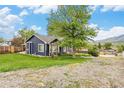 Cozy home with a well-manicured lawn and mature tree at 401 N Columbine St, Golden, CO 80403