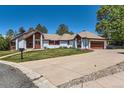 Spacious single-Gathering home with a large driveway and a two-car garage in a Gathering-friendly neighborhood at 6663 S Prescott Way, Littleton, CO 80120