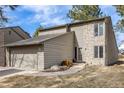 Charming two-story home featuring stone accents, neutral siding and an attached two-car garage at 1579 W Briarwood Ave, Littleton, CO 80120