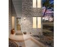 Close up of front porch showcasing stone accents, manicured landscaping, and inviting entry at 1579 W Briarwood Ave, Littleton, CO 80120