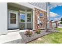 Charming front porch with stone accents, decorative plants, and a welcoming entrance, perfect for enjoying the outdoors at 12860 Jasmine St # C, Thornton, CO 80602