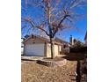 Charming single-story home featuring an attached garage and a well-maintained front yard with a beautiful tree at 9530 Devon Ct, Highlands Ranch, CO 80126